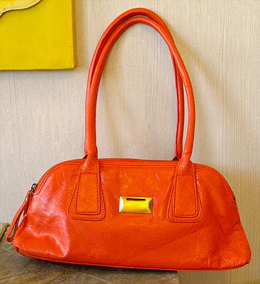 A bright red orange red bag goes with everything!