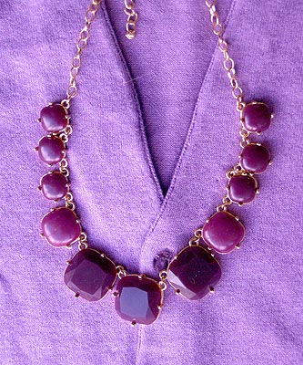 purple stone necklace on a purple spring sweater