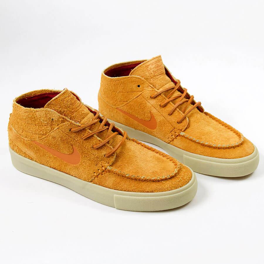sb janoski mid rm crafted tan  and  white skate shoes