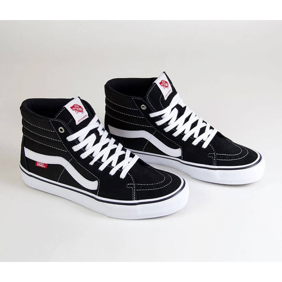 black and white sk8 hi vans