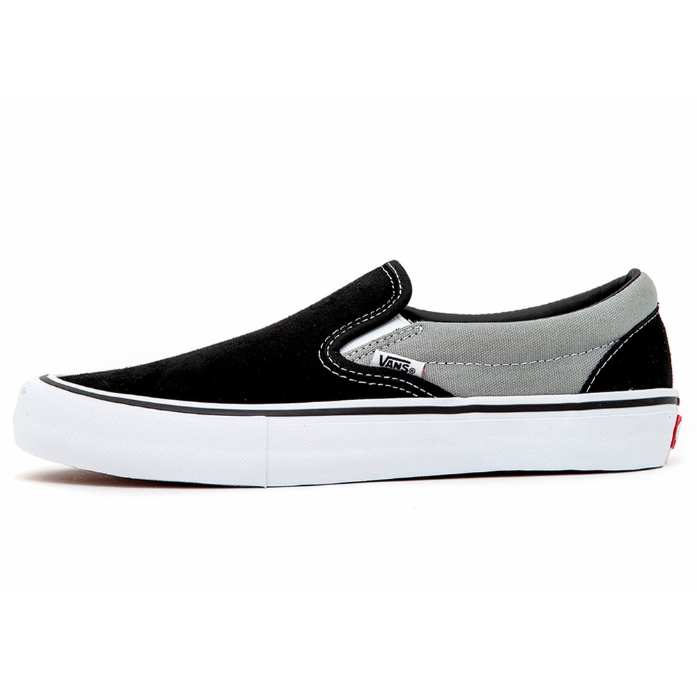 grey and black slip on vans