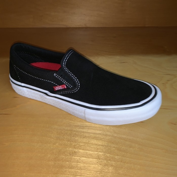 youth black slip on vans