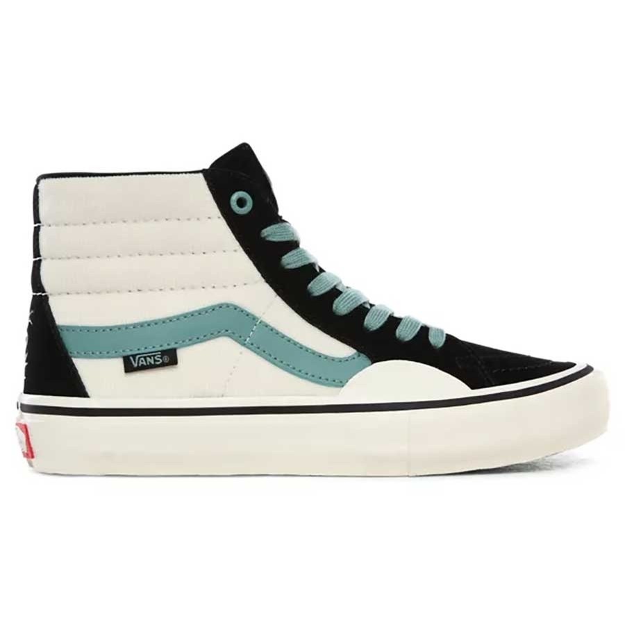 black white and blue vans